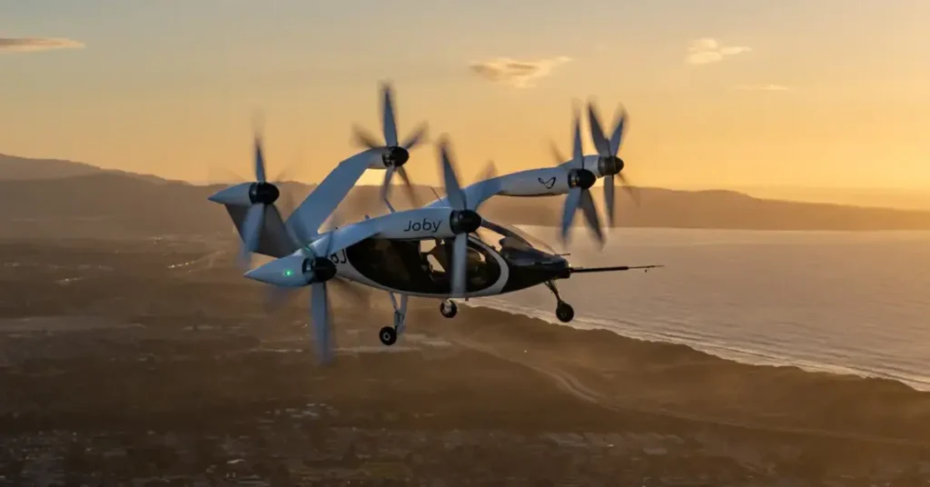 Descubra como os táxis aéreos elétricos (eVTOLs) da Uber, em parceria com a Joby Aviation, vão revolucionar a mobilidade urbana a partir de 2026 com voos sustentáveis e acessíveis